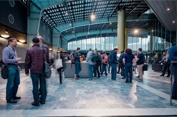 Attendees talking at a RIPE Meeting.